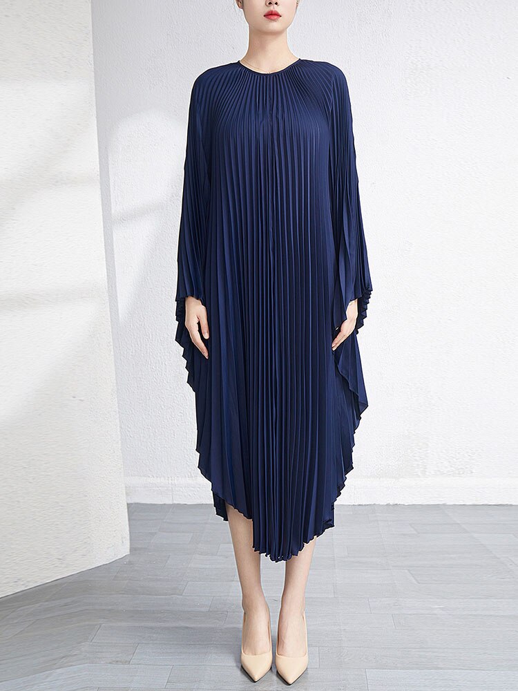 Robe plissée fluide “Crème Élégance” – Style luxe plage ou urbain